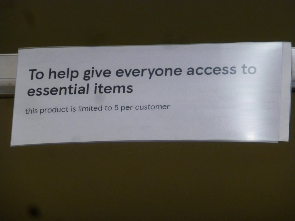 Empty shelves plus signs that